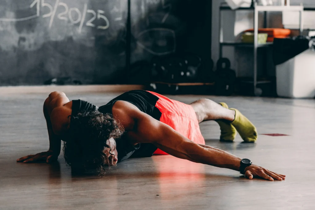 Photo of a person doing a balance pose while lying face down