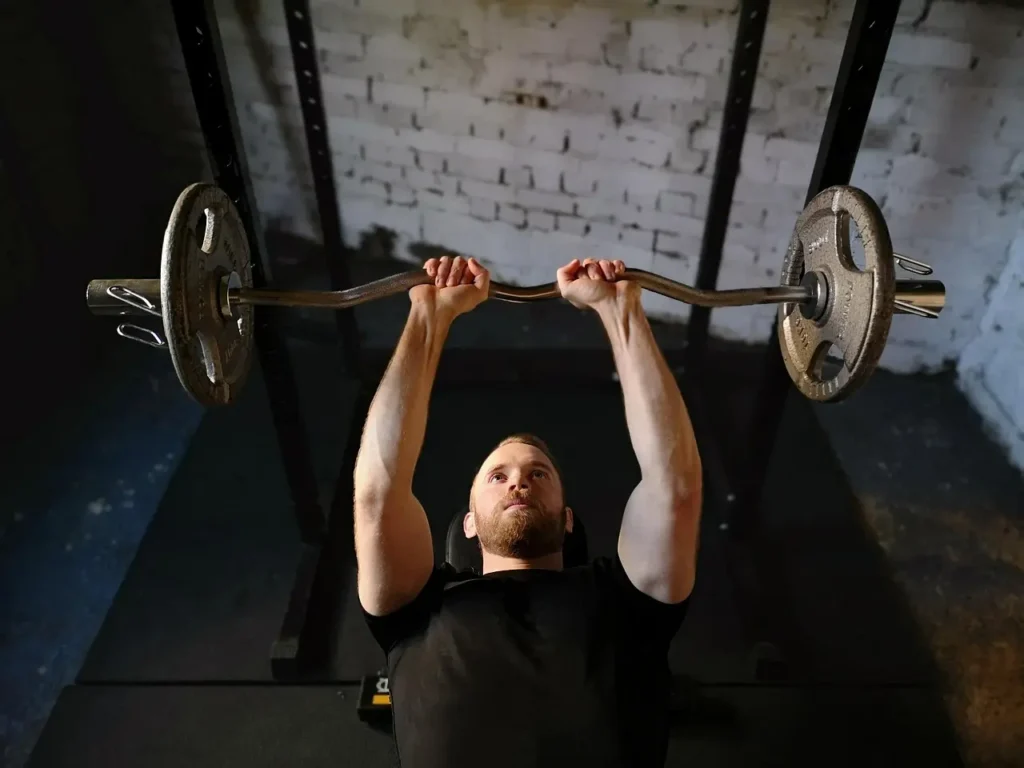 Photo of a man doing weight training in the gym
