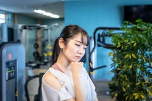 A woman looking worried in a gym