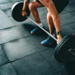 Man preparing to lift a barbell at the gym