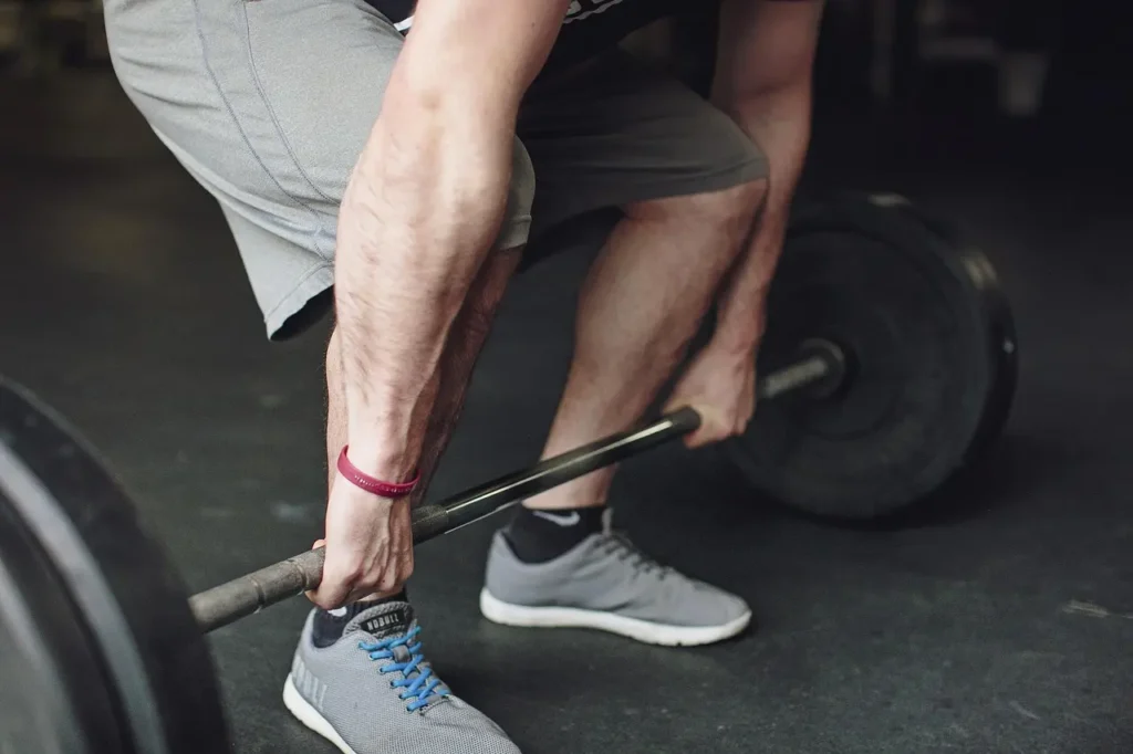 Photo of a man trying to lift a barbell