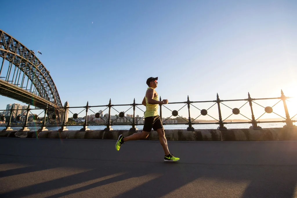 Man running along a river