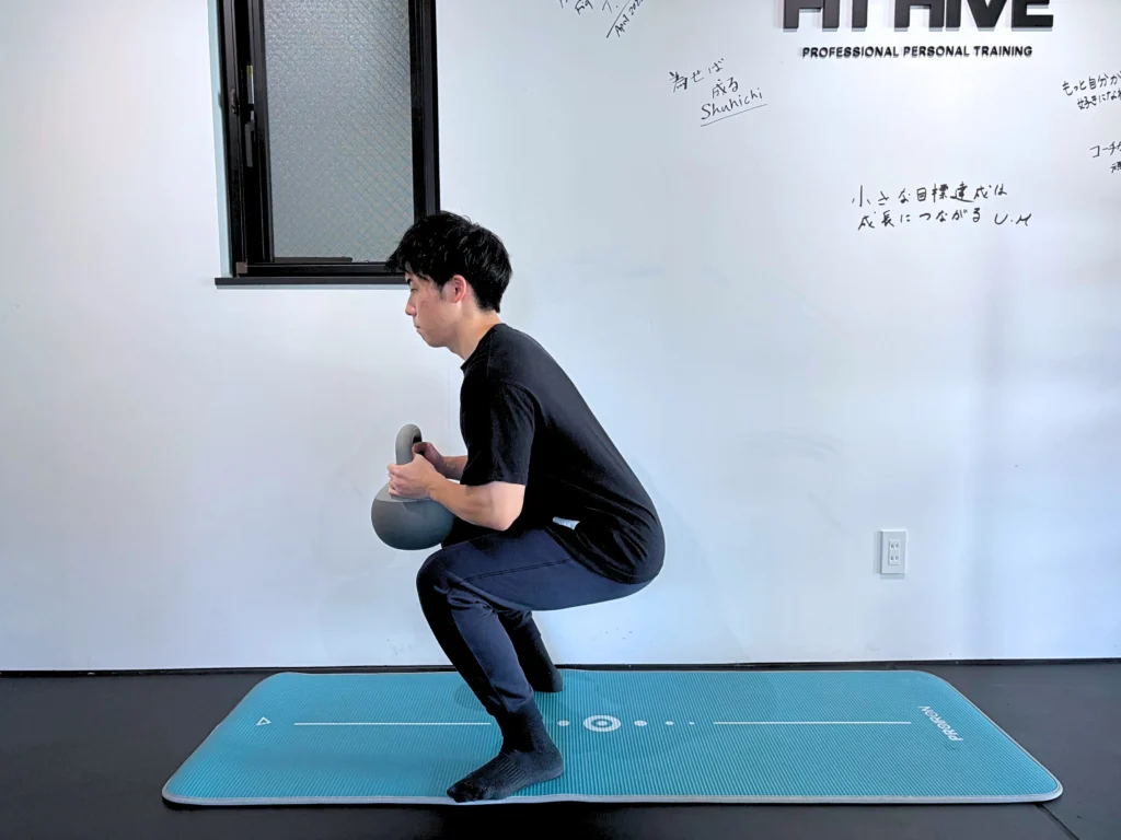 How to perform a goblet squat step 3